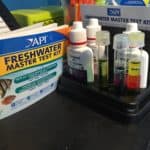 a desk with a box of fresh water and other medical supplies.